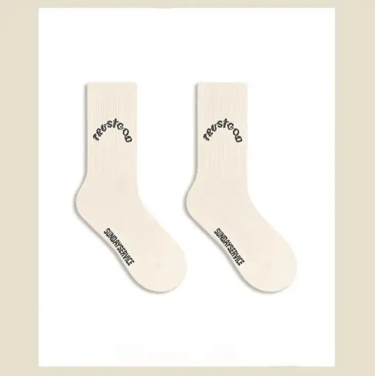 Righteous socks with Kanye West merchandise logo, white crew socks, minimalist design, stylish Streetwear accessory.