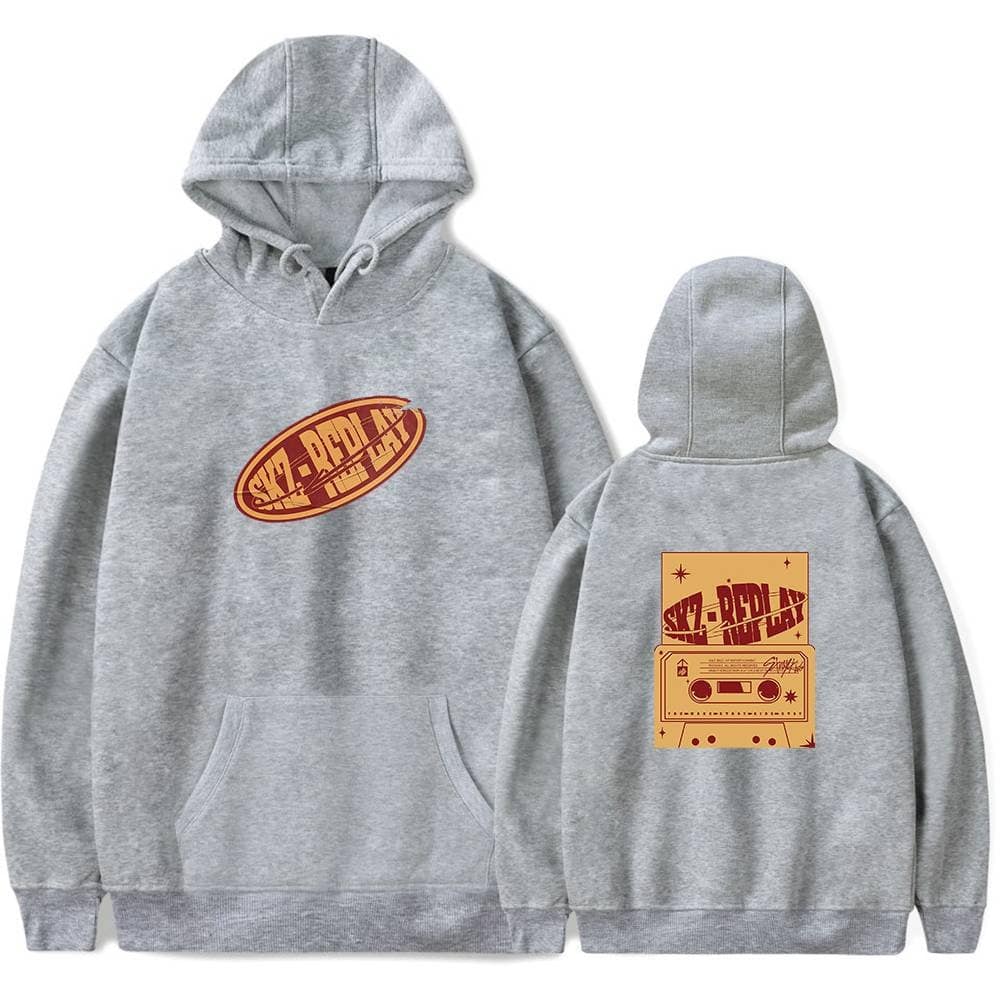 Adjustable gray hoodie with retro Kanye West "Skz-Ray" graphic print on front and cassette tape design on back, featuring vintage-inspired colors and streetwear style.